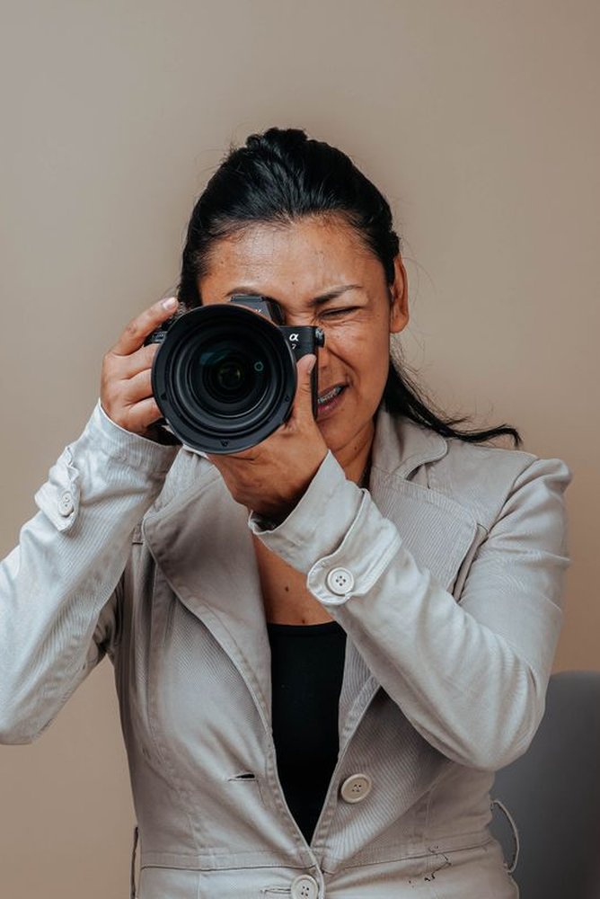 Elena Marlowe at work, film camera in hand