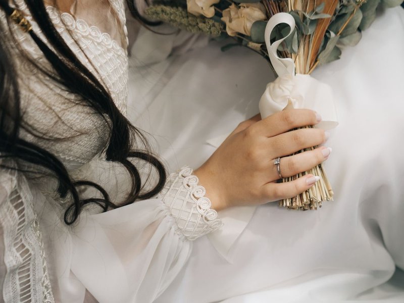 Super8 still — lace sleeve and garden roses, Isla's bouquet